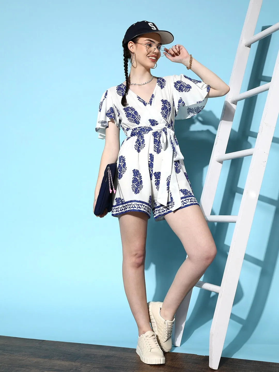 Berrylush Women White & Blue Paisley Printed V-Neck Waist Tie-Up Wrap Mini Playsuit