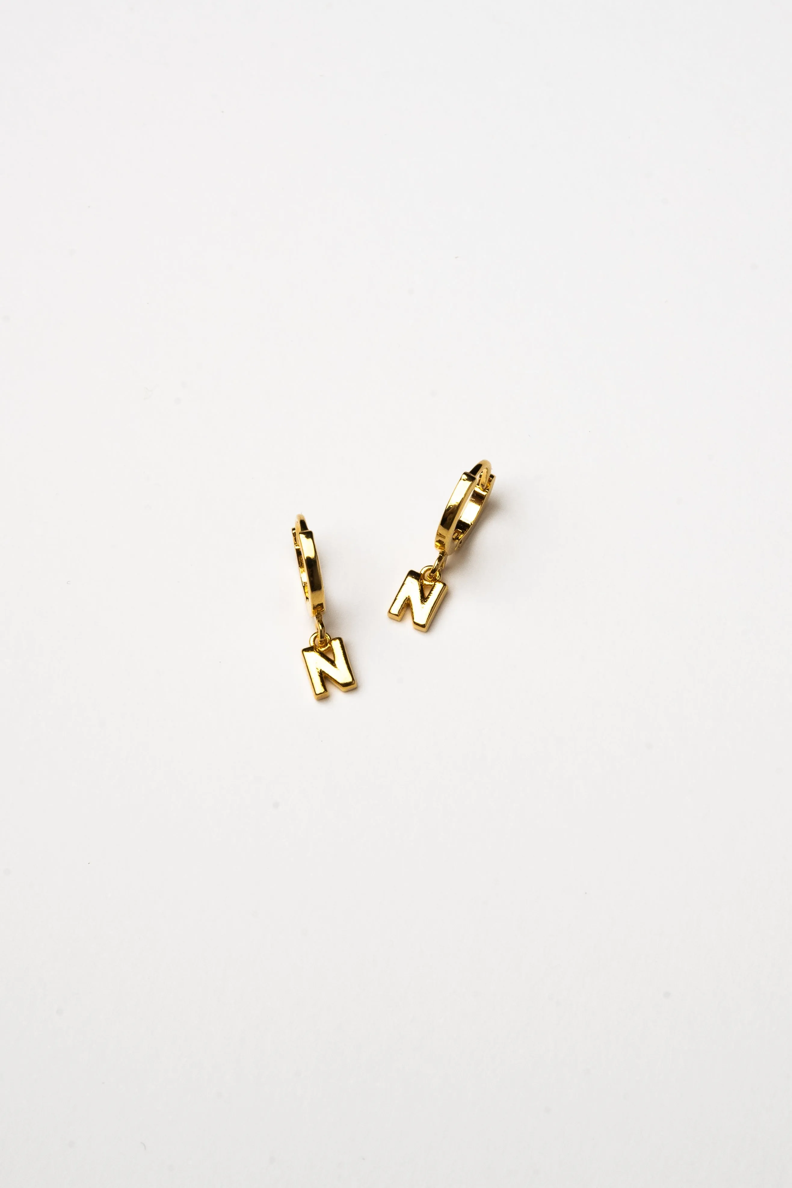Cove Initial Letter Huggie Earrings